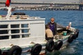 Fishing boat on the Bosporus,surrounded by seagulls in Turkey