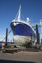 Fishing Boat bring repaired and cleaned in Boatyard, at Fraserburgh Harbour. Aberdeenshire, Scotland, UK.