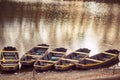 fishing boat in a calm lake water/old wooden fishing boat/ wooden fishing boat in a still lake water Royalty Free Stock Photo