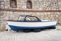 A fishing boat on the car wheels in the street in Bodrum, Turkey Royalty Free Stock Photo