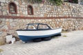 A fishing boat on the car wheels in the street in Bodrum, Turkey