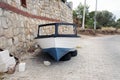 A fishing boat on the car wheels in the street in Bodrum, Turkey