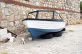 A fishing boat on the car wheels in the street in Bodrum, Turkey