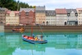 Fishing boat on city river, miniature scene