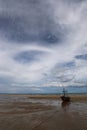 Fishing boat in the cloundy sea