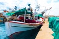 Fishing boat with colorful nets at the dock Royalty Free Stock Photo