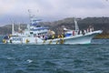 Japanese tuna Boat escaping a Typhoon by coming into port with a wonderful rainbow in the sky.