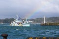 Japanese tuna Boat escaping a Typhoon by coming into port with a wonderful rainbow in the sky.