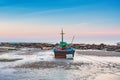 Fishing boat dock on the beach with sunset sky Royalty Free Stock Photo