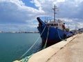 Fishing boat docked in the harbor on a sunny day Royalty Free Stock Photo