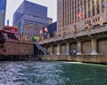 Fishing boat with fisherman in the corner of the area at the Franklin Street bridge near the Merchandise Mart in Chicago on the Ch Royalty Free Stock Photo