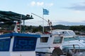 Fishing boat with flag of Greece in harbour Royalty Free Stock Photo