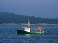 Fishing boat in fog Royalty Free Stock Photo