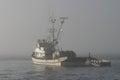 Fishing Boat In Fog Royalty Free Stock Photo
