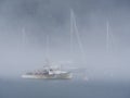 Fishing boat in fog Royalty Free Stock Photo