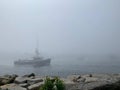 Fishing Boat in Fog Royalty Free Stock Photo