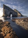 Fishing boat in front of Drangarnier rock formations on Vagar, Faroe Islands