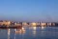 FIshing boat on front of Kadikoy seafront, on the Asian side of the city, with the main buildings of the distrinct Royalty Free Stock Photo