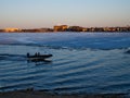 Fishing boat on frozen Lake Bemidji at sunset