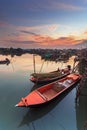 Small fishing boat at fisherman village with sunset Royalty Free Stock Photo