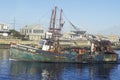 A fishing boat heading out from the wharf at Point Judith, Rhode Island