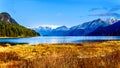 Fishing Boat heading up Pitt Lake with the Peaks of the Golden Ears, Tingle Peak and other Peaks in the Coast Mountain Royalty Free Stock Photo