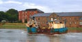 Fishing boat heading up the river Nene.