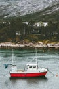 Fishing boat and house in forest island sea Landscape in Norway Royalty Free Stock Photo