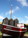 Fishing Boat and net huts on the beach at Hastings, East Sussex, England UK Royalty Free Stock Photo