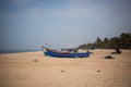 Fishing boat of Indian fishermen on the sandy beach in Kerala, fishing village Marari