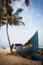 Fishing boat of Indian fishermen on the sandy beach in Kerala, fishing village Marari