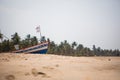 Fishing boat of Indian fishermen on the sandy beach in Kerala, fishing village Marari