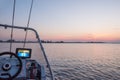 A fishing boat with instruments and an echosounder at dawn on the water. Royalty Free Stock Photo