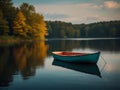 Fishing boat on the lake. Beautiful autumn landscape in the forest. Royalty Free Stock Photo