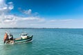 Fishing boat leaving the harbor of Barfleur Royalty Free Stock Photo