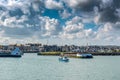 Fishing boat leaving the harbor of Barfleur, Royalty Free Stock Photo