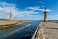 Fishing boat leaving Whitby harbour entrance Royalty Free Stock Photo