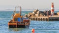 Fishing boat and light house