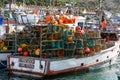 Fishing boat loaded with fishing baskets Royalty Free Stock Photo