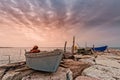 Fishing boat moored on cliff at sunset. Royalty Free Stock Photo