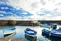 Fishing boat moored at the harbor of Acitrezza, Sicily