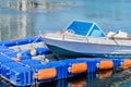 Fishing boat moored to floating dock Royalty Free Stock Photo