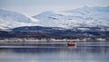 Fishing boat near Sandtorgholmen on the Tjelsundet strait in winter in Norway Royalty Free Stock Photo