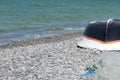 Fishing boat and net lie on the beach, Calis, Fethiye, Turkey. Royalty Free Stock Photo