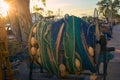 Fishing boat nets rolled up on winch drums on a trawler moored in Harbour Royalty Free Stock Photo