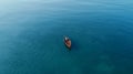 Fishing from a boat in the open ocean, a hobby of catching fish. Beautiful seascape, aerial view. travel banner. Royalty Free Stock Photo