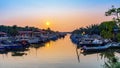 Calm fishing village with boat during sunset Royalty Free Stock Photo