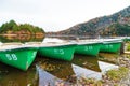 Fishing boat park on lake in evening autumn mountain