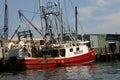 Fishing boat in a port waits for next tide