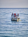 Fishing boat pulling nets out of the sea Royalty Free Stock Photo